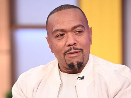timbaland in an interview wearing a white suit 